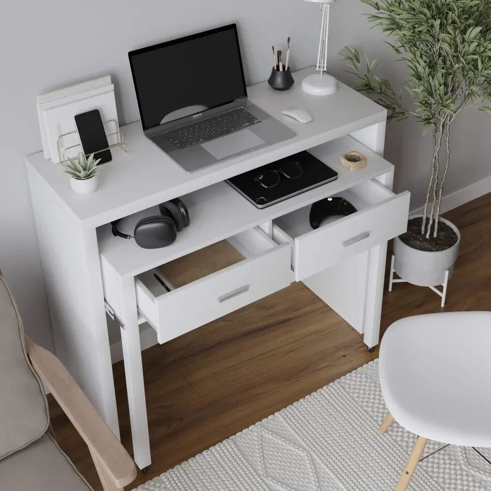 3D visualization of a white desk with laptop, drawers, headphones, and decor in a home office