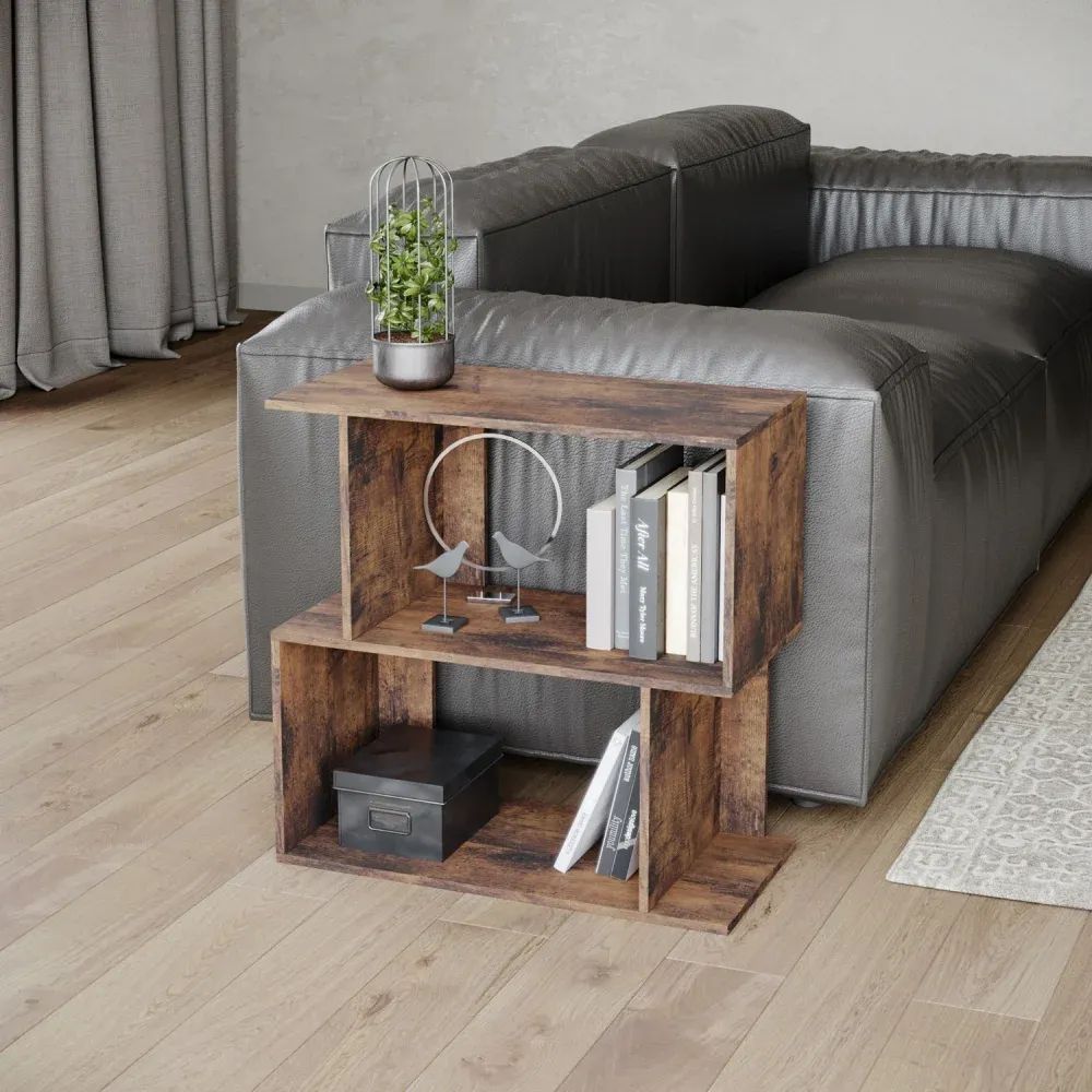 3D visualization services of a wooden side shelf with books, decor, and plant next to a gray sofa