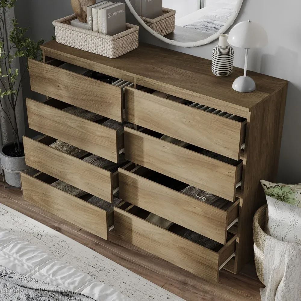 3D visualization of a wooden dresser with multiple drawers open, revealing neatly folded clothes inside