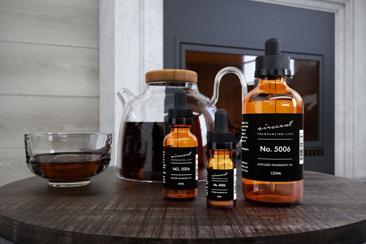 Fragrance Bottles Group Shot near a Teapot