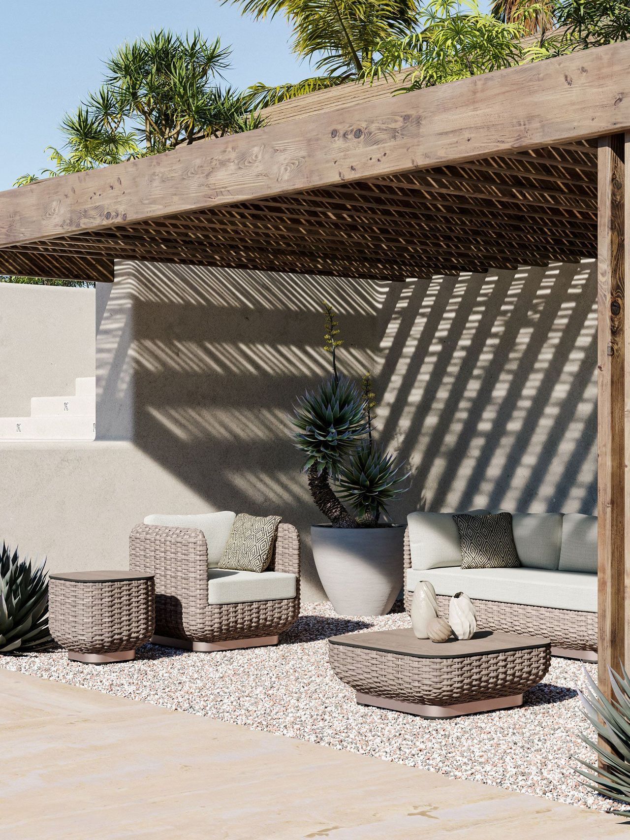 Lifestyle Rendering Of An Outdoor Lounge Area With Wicker Furniture And A Wooden Pergola