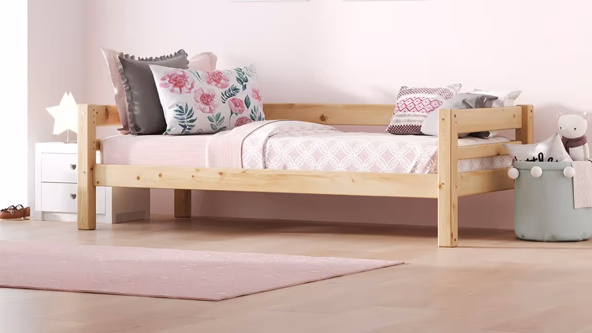 3D visualization of kids’ bedroom furniture featuring a wooden bed with pink bedding and decorative pillows