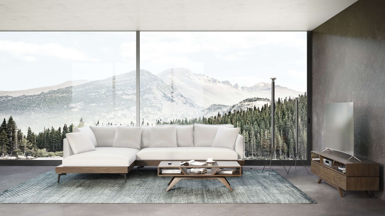 3D visualization of a room with a white sectional sofa, a glass coffee table, and a mountain view