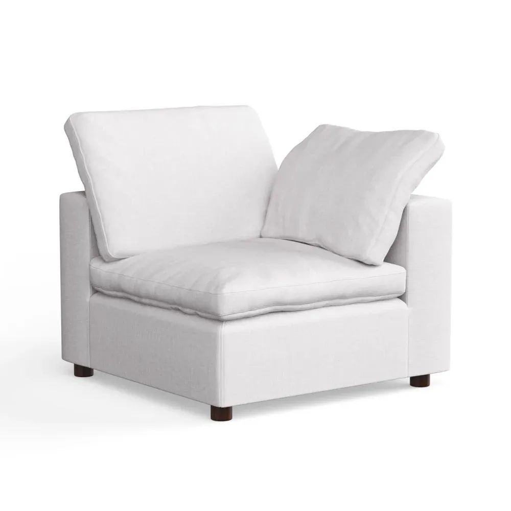 3D Product imagery for catalogs showing a modern white fabric corner armchair with cushions on plain background