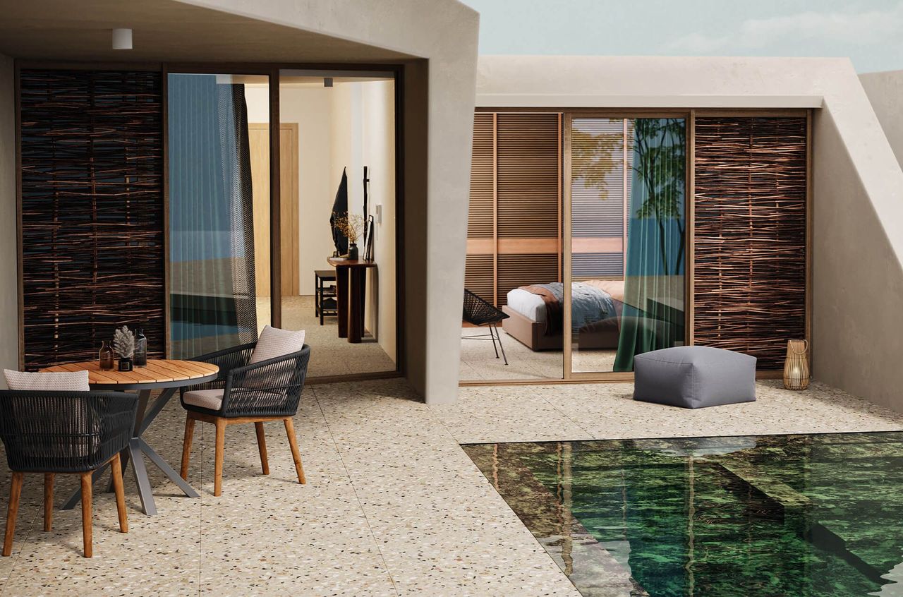 3D visualization of a modern outdoor terrace with wicker chairs, round table, and poolside glass doors