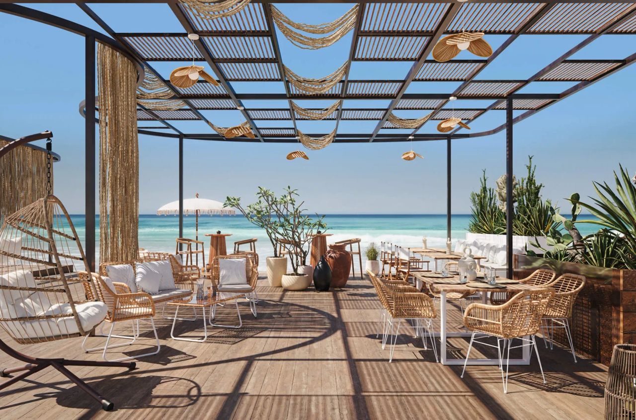 3D visualization of beach lounge with wicker chairs, tables, hanging swing, and ocean view under pergola