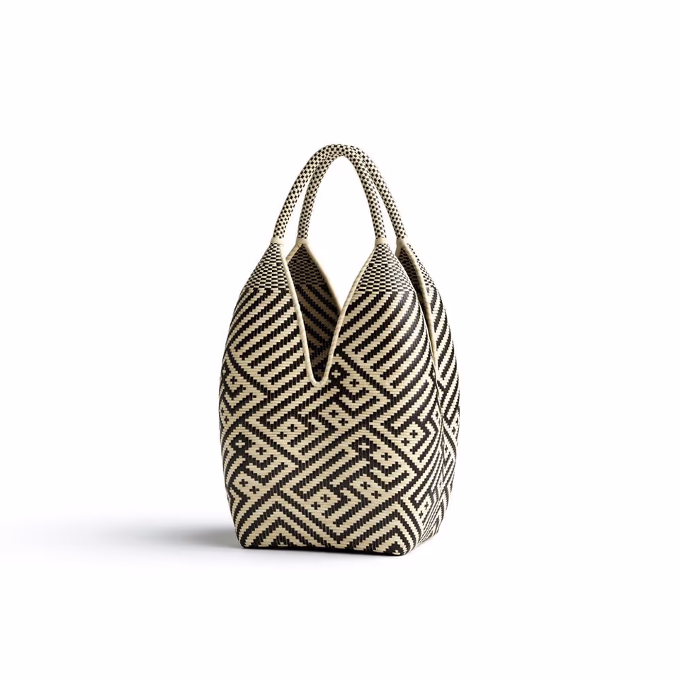 Photorealistic 3D rendering of a designer bag showcasing intricate patterns, highlighting 3D product visualization and CGI rendering techniques.